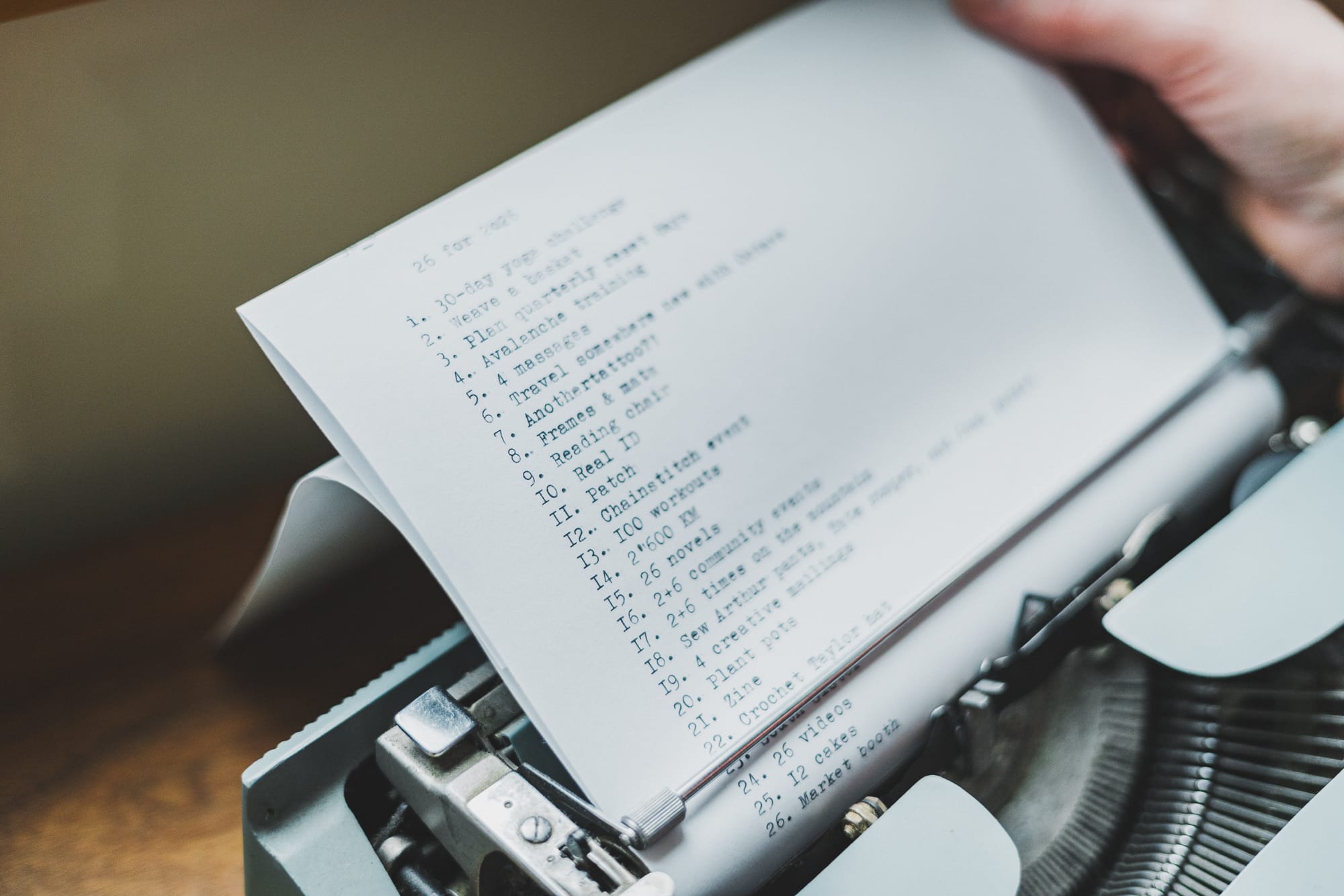 Close-up of a typewritten page titled “26 for 2026,” showing a numbered list of goals resting in a vintage typewriter.